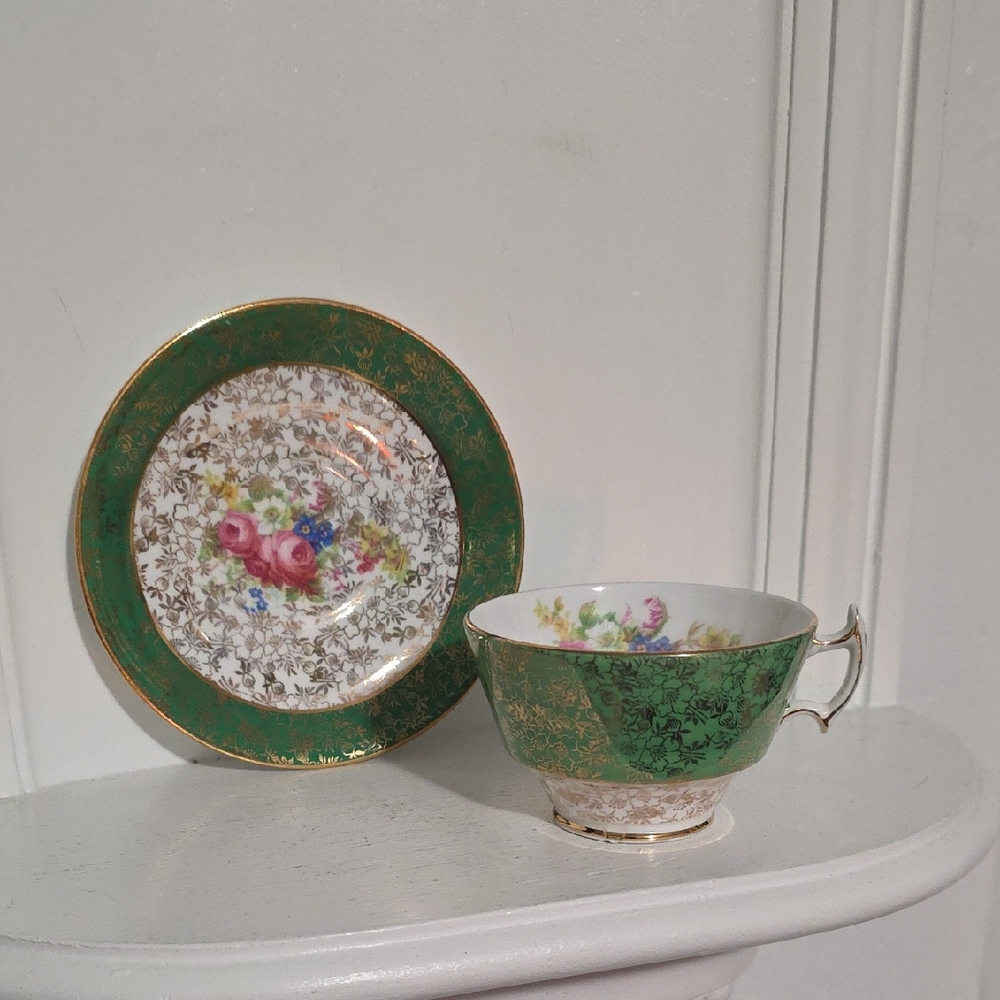 This is a Royal Staffordshire emerald green and gold chintz bone china 22kt Gold